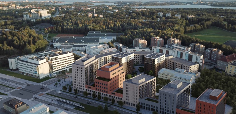 Helsingin Pitäjämäen Kutomotiellä sijaitsevan uuden asuinkorttelin havainnekuva. Valaja on keskimmäisistä kaksivärisistä taloista vasemmalla. Ilmakuva, jossa eri värisiä kerrostaloja. Talojen edessä tie, jossa kulkee raitiovaunu. Taustalla luontoa ja meri.